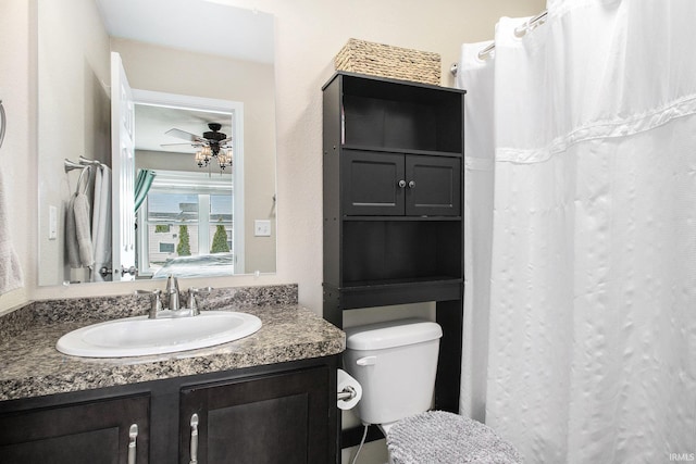 bathroom with vanity, ceiling fan, and toilet