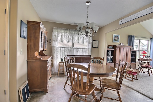 dining space featuring an inviting chandelier, carpet, and visible vents