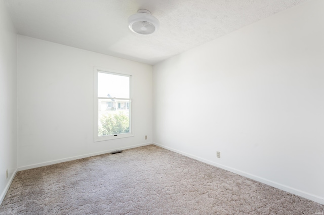 208 E Hickory Grove Rd, Hartford City, IN 47348 - carpeted empty room with baseboards and visible vents