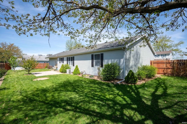 208 E Hickory Grove Rd, Hartford City, IN 47348 - back of house with a patio area, fence, and a yard