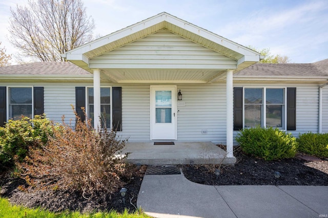 208 E Hickory Grove Rd, Hartford City, IN 47348 - doorway to property with a porch and a shingled roof