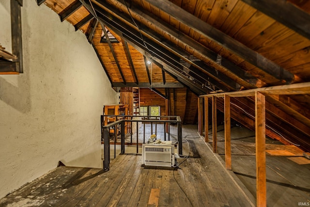 unfinished attic with an upstairs landing