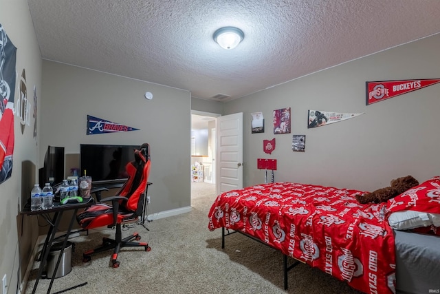 bedroom with carpet flooring, a textured ceiling, visible vents, and baseboards