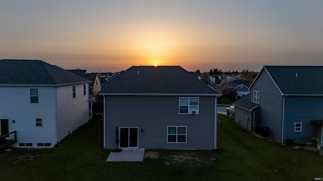 rear view of house with a residential view, a patio, and a yard