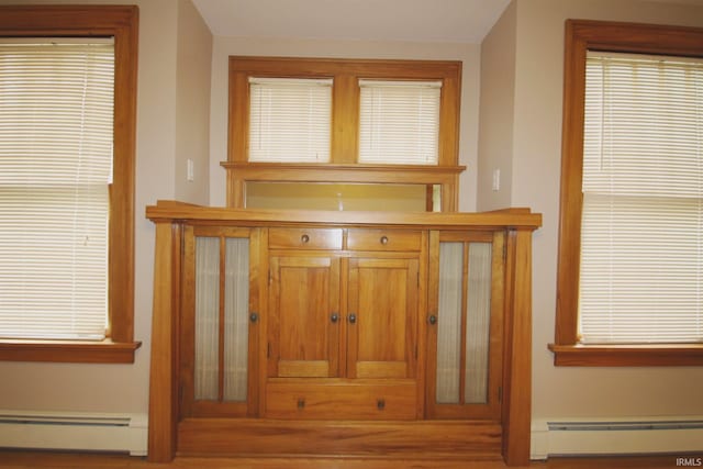 interior details featuring a baseboard radiator