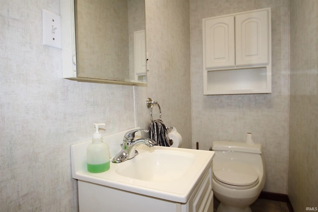 bathroom with vanity and toilet