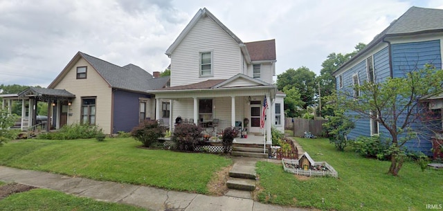view of front of home with a front lawn and covered porch