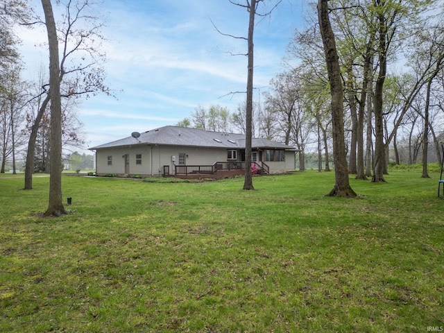 view of yard with a deck