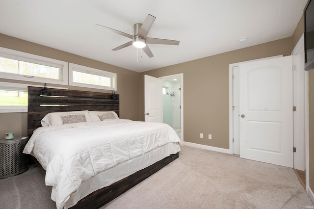13440 N Summerhill Dr, Albany, IN 47320 - carpeted bedroom featuring a ceiling fan, baseboards, and ensuite bathroom