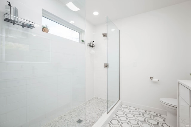 13440 N Summerhill Dr, Albany, IN 47320 - bathroom with a walk in shower, baseboards, toilet, and tile patterned flooring