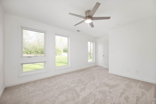 13440 N Summerhill Dr, Albany, IN 47320 - empty room featuring light colored carpet, baseboards, ceiling fan, and visible vents