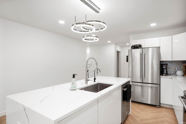 13440 N Summerhill Dr, Albany, IN 47320 - kitchen featuring a center island with sink, recessed lighting, white cabinets, a sink, and stainless steel appliances