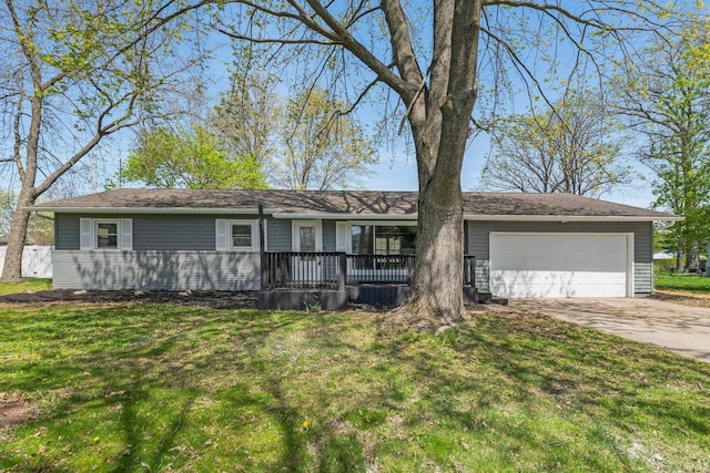 ranch-style home featuring a porch, an attached garage, driveway, and a front lawn