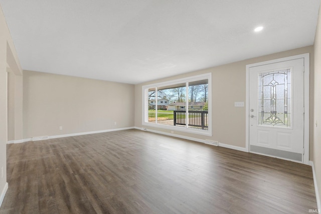 entryway with baseboards, recessed lighting, dark wood-style floors, and visible vents