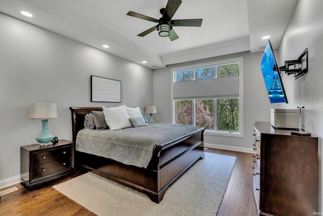 bedroom featuring recessed lighting, baseboards, wood finished floors, and visible vents