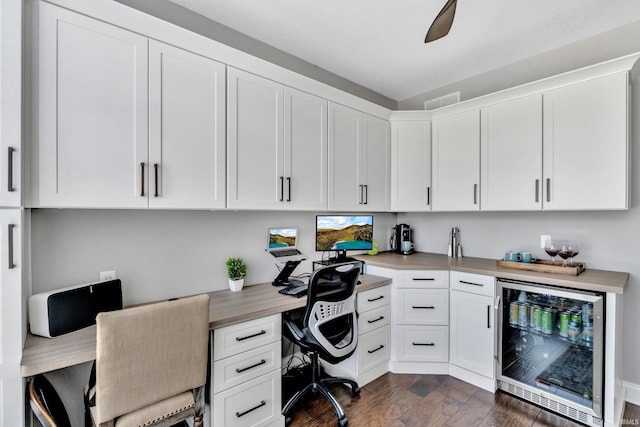 office featuring wine cooler and dark wood-type flooring