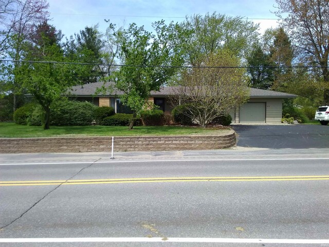 single story home with an attached garage and driveway