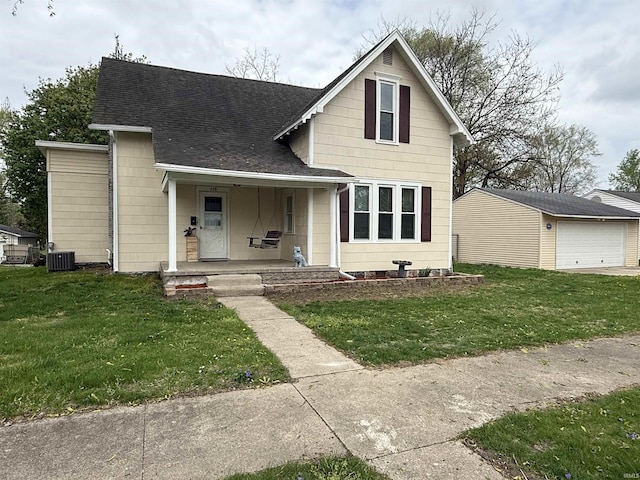 view of front of home featuring an outdoor structure, a front lawn, cooling unit, a shingled roof, and a porch