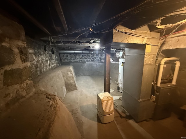 unfinished below grade area with heating unit and gas water heater