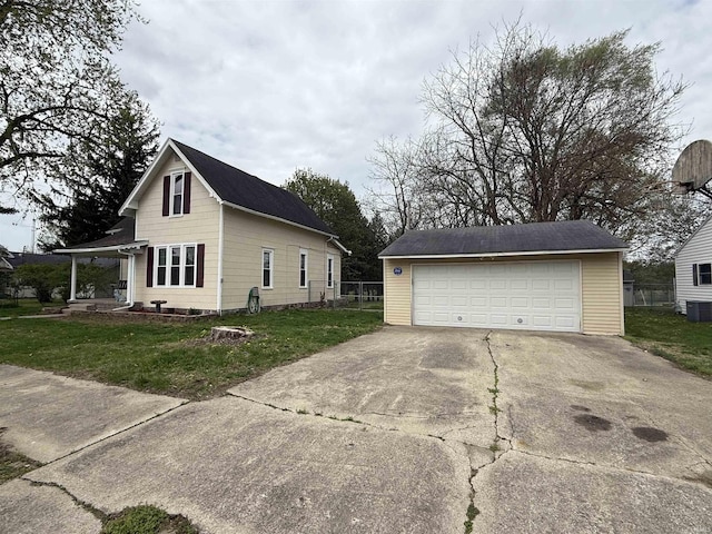 view of property exterior with fence, central air condition unit, a detached garage, an outbuilding, and a lawn