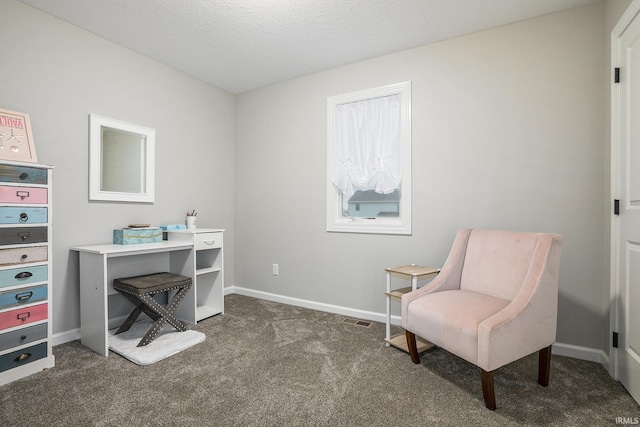 office space featuring dark carpet, baseboards, and visible vents
