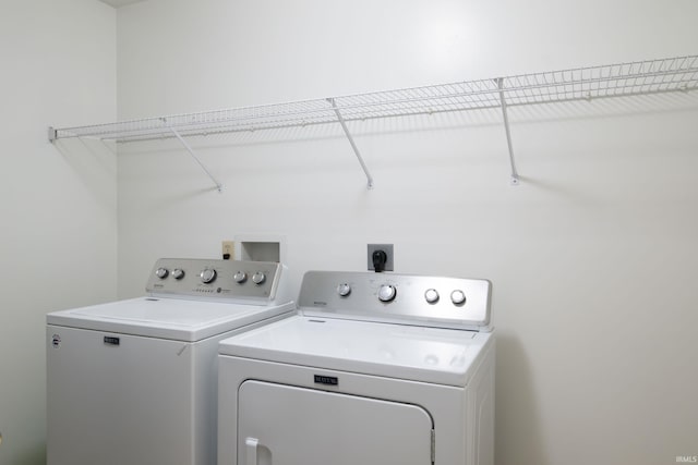 washroom with laundry area and washing machine and dryer