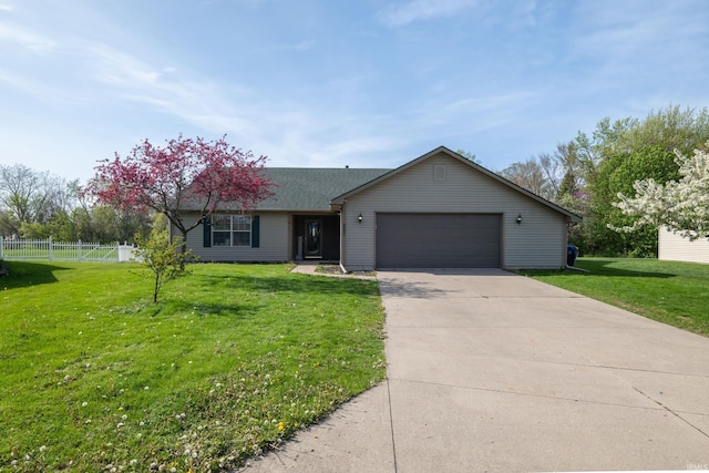 single story home with concrete driveway, an attached garage, fence, and a front lawn
