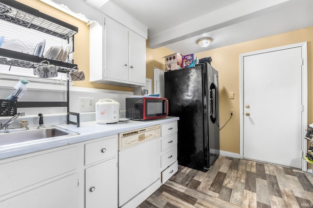 kitchen with wood finished floors, dishwasher, light countertops, black refrigerator with ice dispenser, and white cabinetry