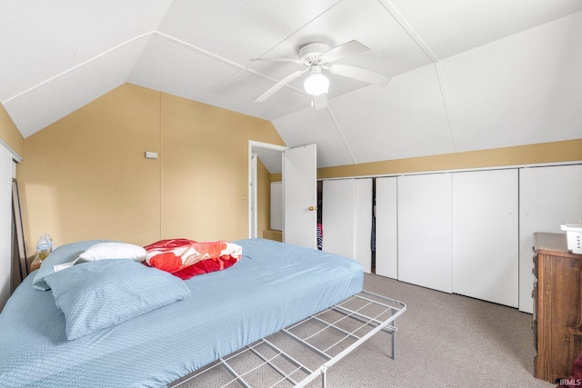 carpeted bedroom with ceiling fan and lofted ceiling