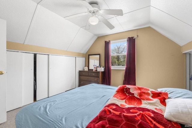 bedroom featuring carpet flooring, a ceiling fan, and vaulted ceiling