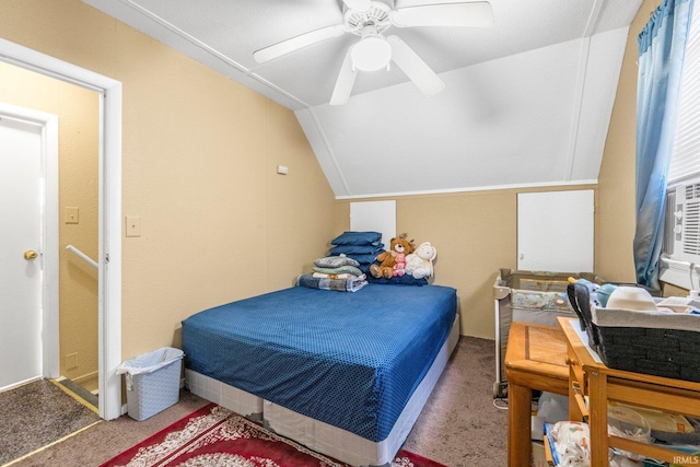 carpeted bedroom featuring a ceiling fan and vaulted ceiling