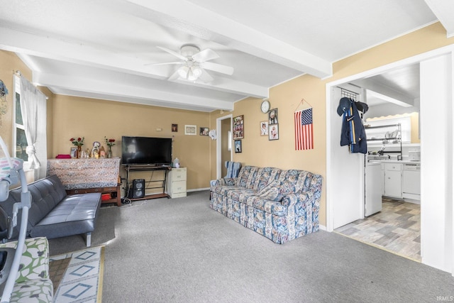 living room with light colored carpet, ceiling fan, and beam ceiling