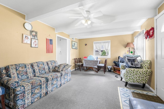 carpeted living room featuring baseboards, ceiling fan, and beamed ceiling