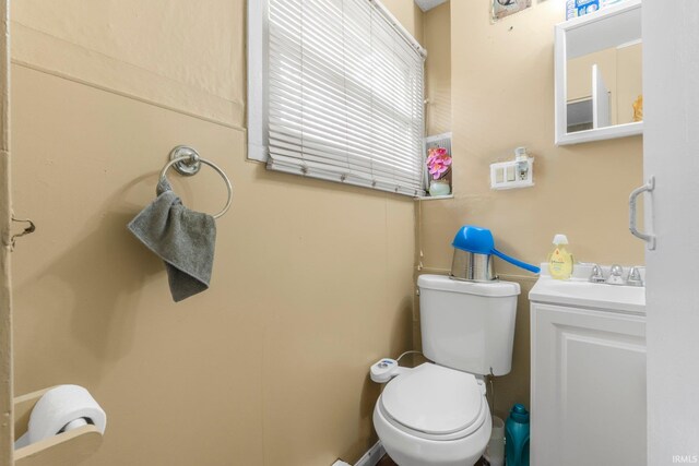 half bath with vanity and toilet