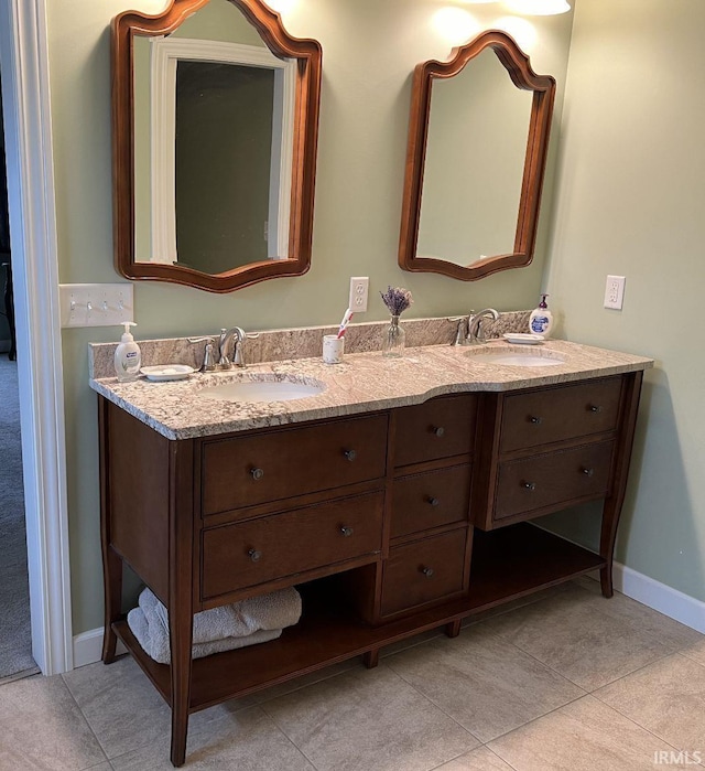full bath featuring a sink, tile patterned flooring, and double vanity
