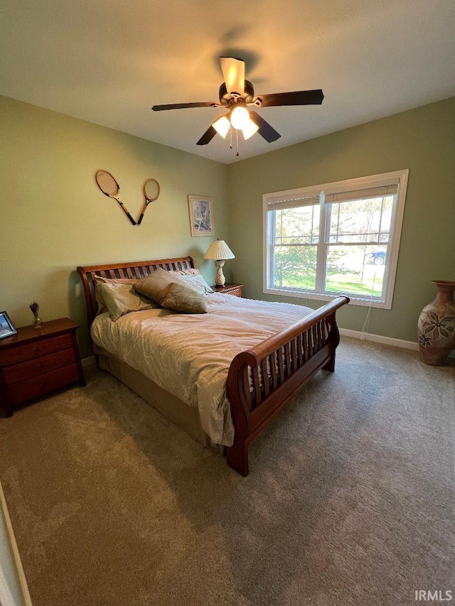 bedroom with carpet floors, ceiling fan, and baseboards