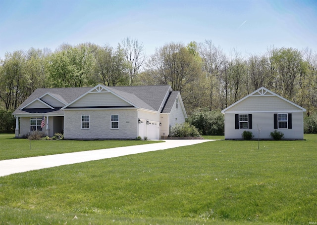 view of front of property with a garage, concrete driveway, and a front yard