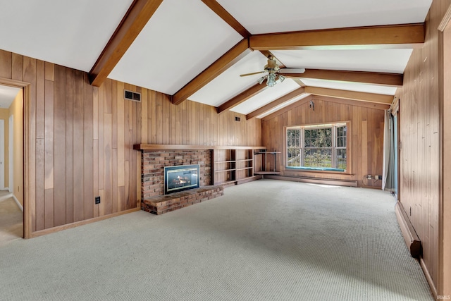 8818 Fortuna Way, Fort Wayne, IN 46815 - unfurnished living room with wooden walls, ceiling fan, baseboard heating, a brick fireplace, and vaulted ceiling with beams