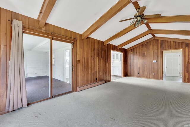 8818 Fortuna Way, Fort Wayne, IN 46815 - unfurnished living room featuring wooden walls, a ceiling fan, a baseboard heating unit, and vaulted ceiling with beams