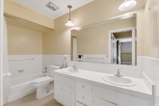 8818 Fortuna Way, Fort Wayne, IN 46815 - full bathroom with a sink, a wainscoted wall, toilet, and visible vents