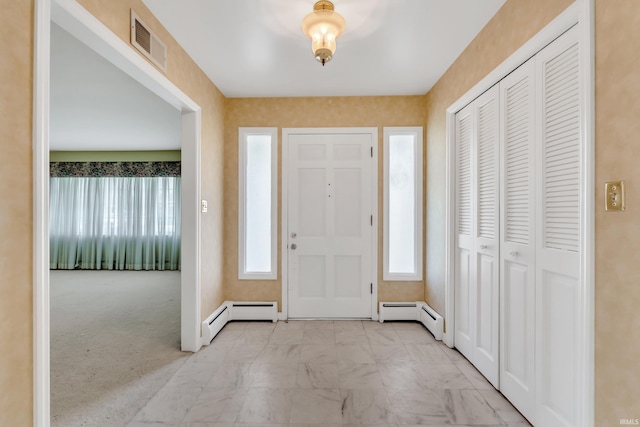 8818 Fortuna Way, Fort Wayne, IN 46815 - foyer entrance featuring baseboards, baseboard heating, marble finish floor, and visible vents
