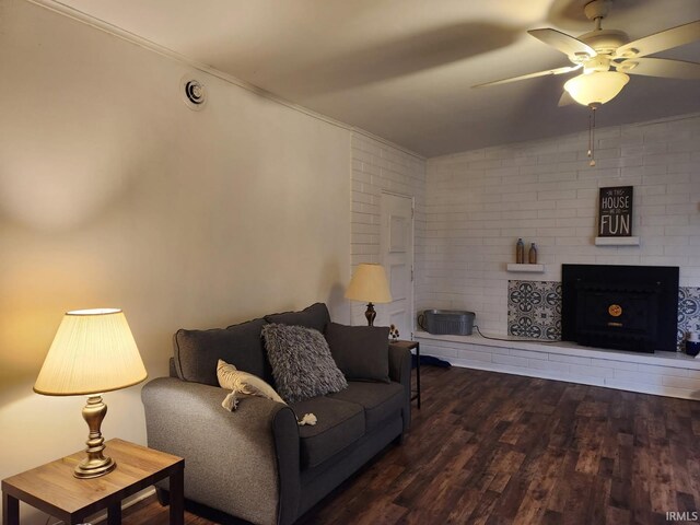 2203 S Valley Ave, Marion, IN 46953 - living area featuring crown molding, a ceiling fan, wood finished floors, and a fireplace