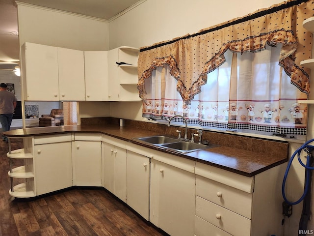 2203 S Valley Ave, Marion, IN 46953 - kitchen with dark countertops, open shelves, a sink, dark wood-style floors, and white cabinetry