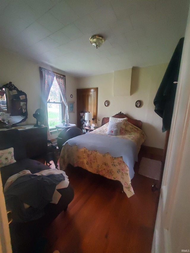 bedroom featuring wood finished floors