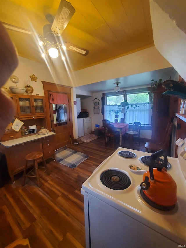 interior space featuring electric range and wood finished floors