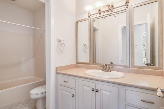 bathroom with toilet, bathtub / shower combination, and vanity