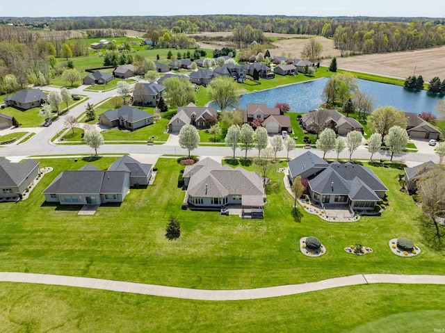 bird's eye view featuring a water view and a residential view