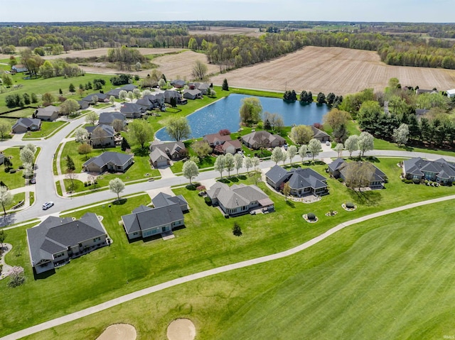 birds eye view of property with a residential view and a water view