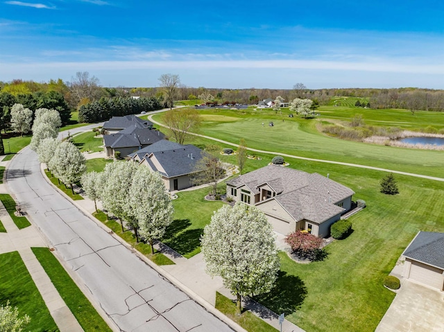 bird's eye view with view of golf course and a water view