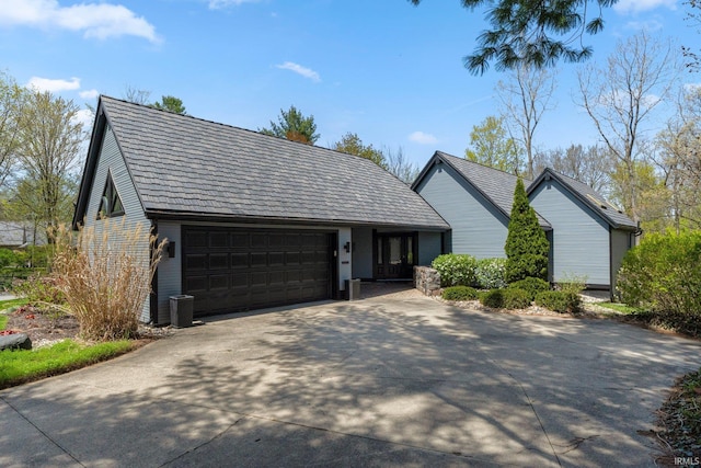 view of front of house featuring an attached garage and concrete driveway